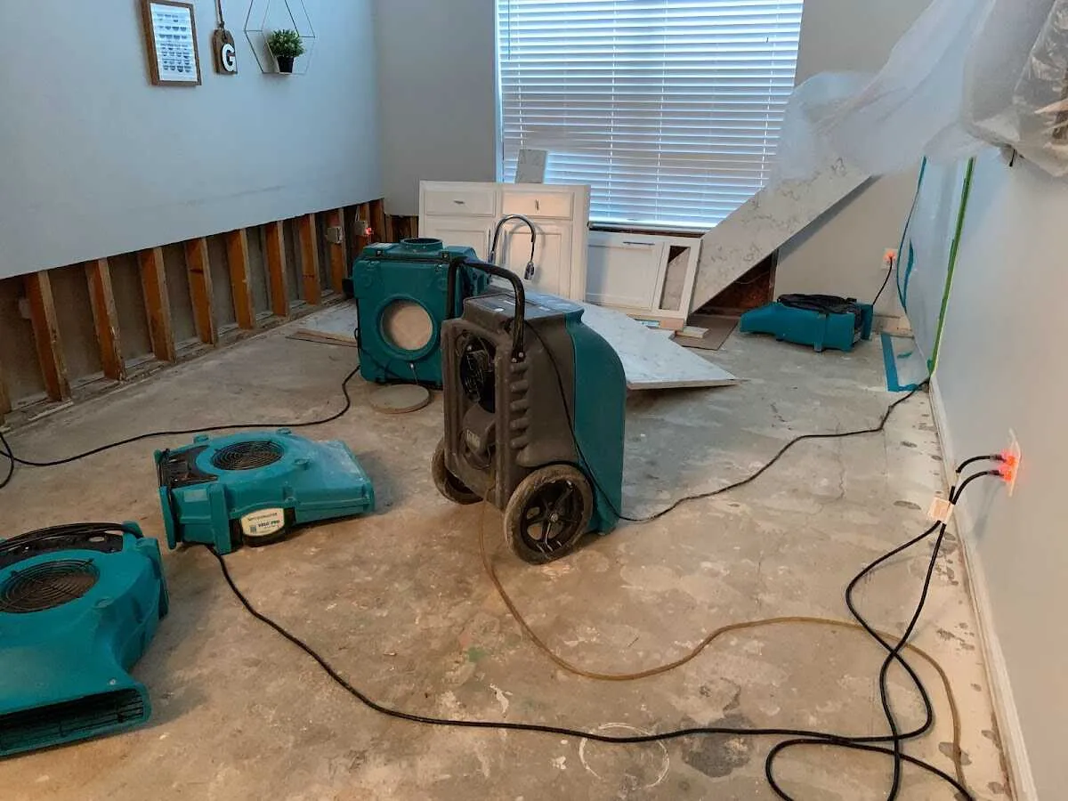 Dehumidifier in flood-cut room for Water Damage Restoration in Pavilion